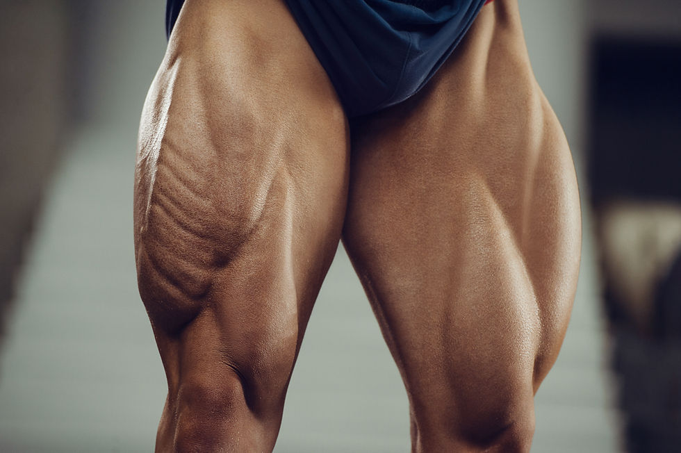 Close-up of muscular legs showing quad and hamstring definition, representing gay men’s lower-body fitness goals.