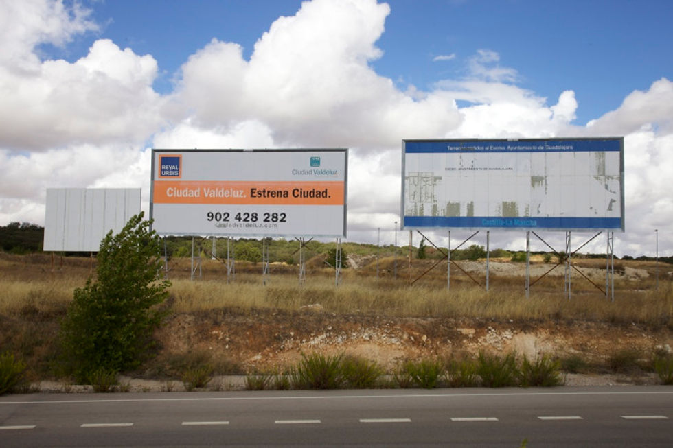 Faded advertising hoardings, Valdeluz