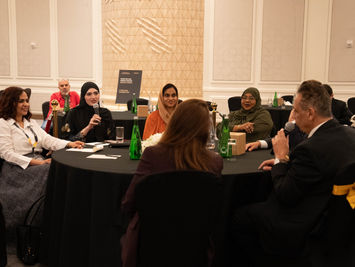 Participants in conversation around a roundtable