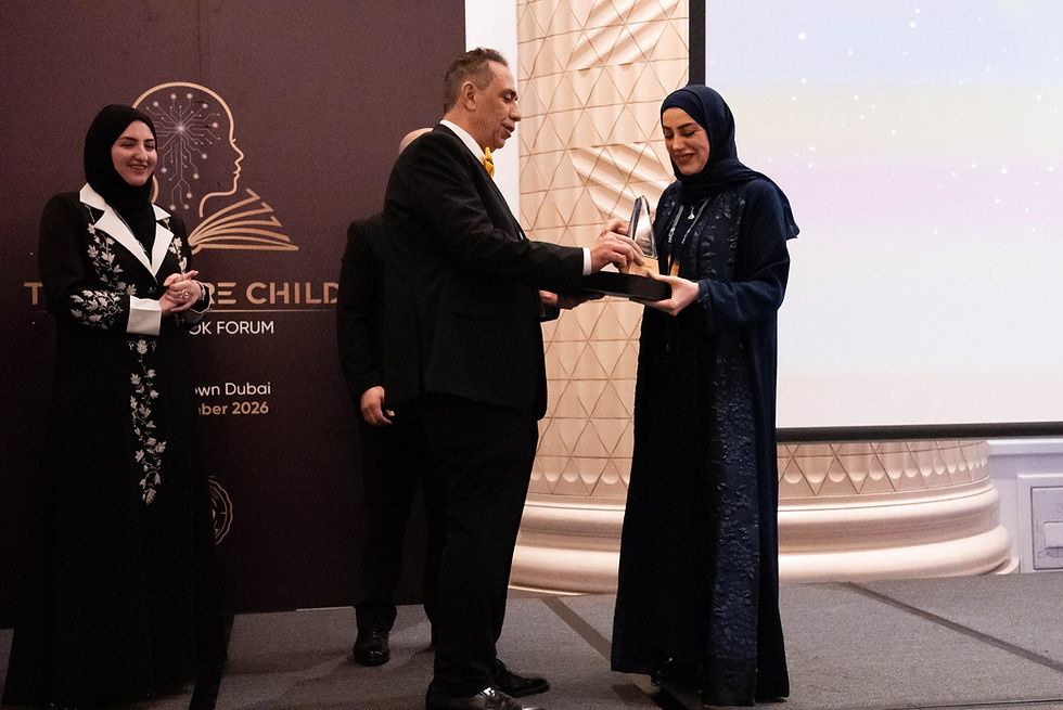 Dr. Fatma Aljassim receiving the Legacy Honour