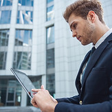Professional working on digital device