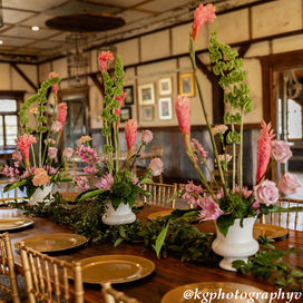 Rustic wedding venue with table centerpiece.