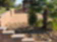 Belgard pavers with Tremon wall and river rock