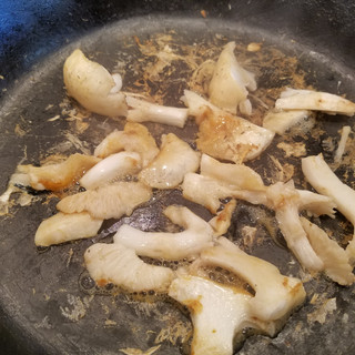 Dry fry the mushrooms in batches in a preferably cast iron skillet heated to medium high heat, stirring frequently until 1/2 of the moisture has evaporated from them. Remove them from the pan and set them aside. This process takes about 15 minutes.