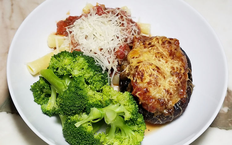 This is a tasty dish my husband taught me! Well, he was making something similar for himself before we got married. His version was the basics, large Portobello mushrooms stuffed with mild Italian sausage then topped with mozzarella cheese. All baked together in yummy harmony. Really I just stepped it up with the addition of some mushroom marinara. Try this either way depending on how much time you have or how much energy you would like to put into dinner. Trust me it will be delicious!