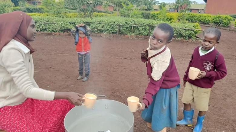 Children receiving food at Tloma Primary School