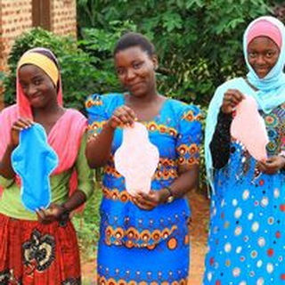 Ladies holding different colors of the Salama pads