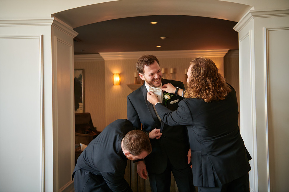 groomsmen having fun with groom