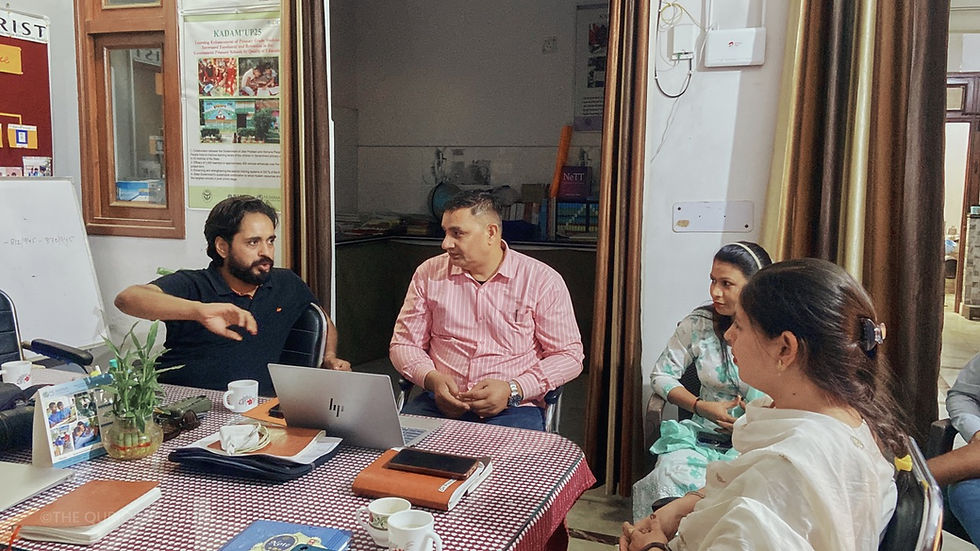 A brand film production team at The Qurious Studio discussing a client brief before the shoot begins