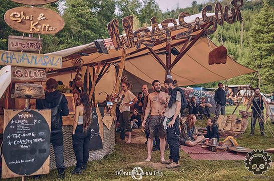 Festival-goers at Masters of Puppets enjoying healthy vegetarian snacks from a food vendor on the Rage Stage arena