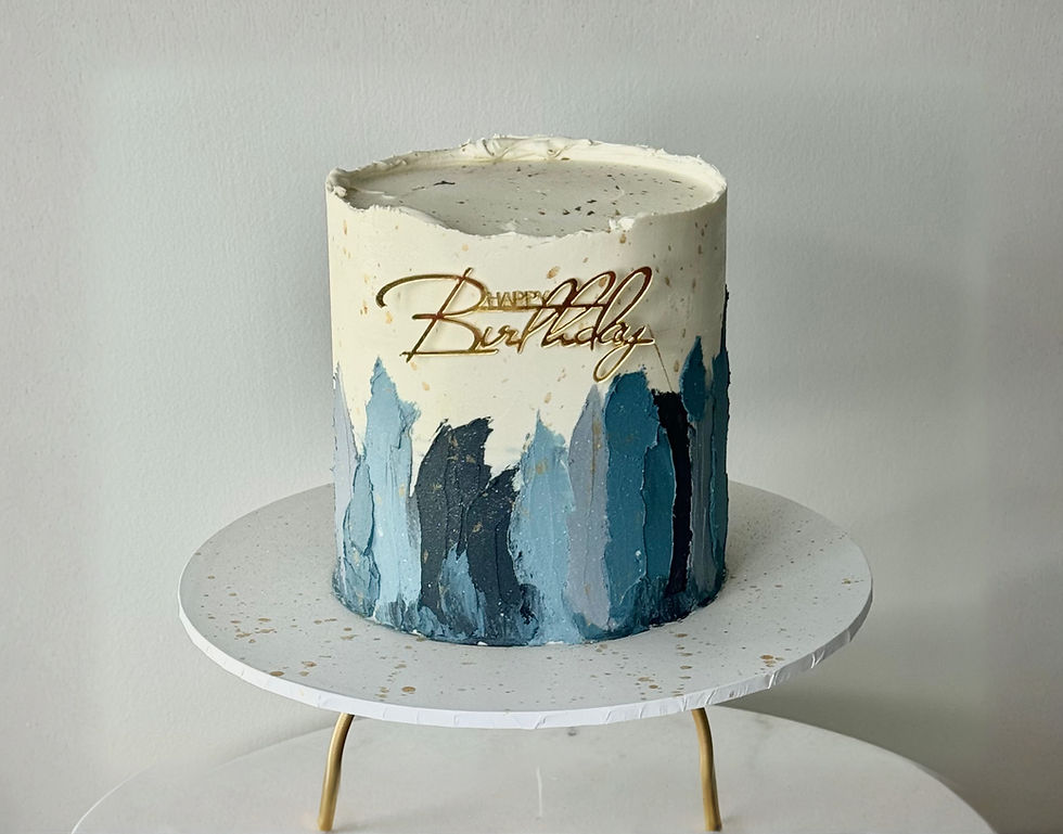 “Modern birthday cake with abstract blue brushstroke design and minimalist finish”