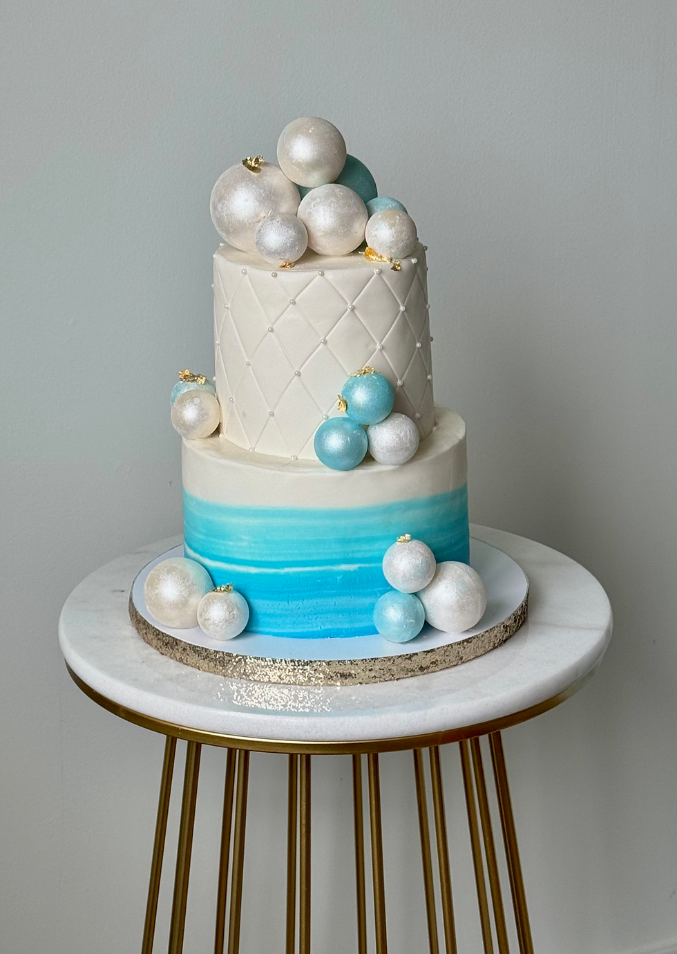 2 tier cake with chocolate spheres