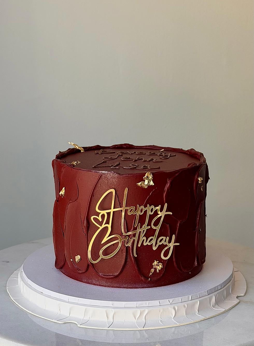 Burgundy birthday cake with edible gold leaf in St. John's Newfoundland