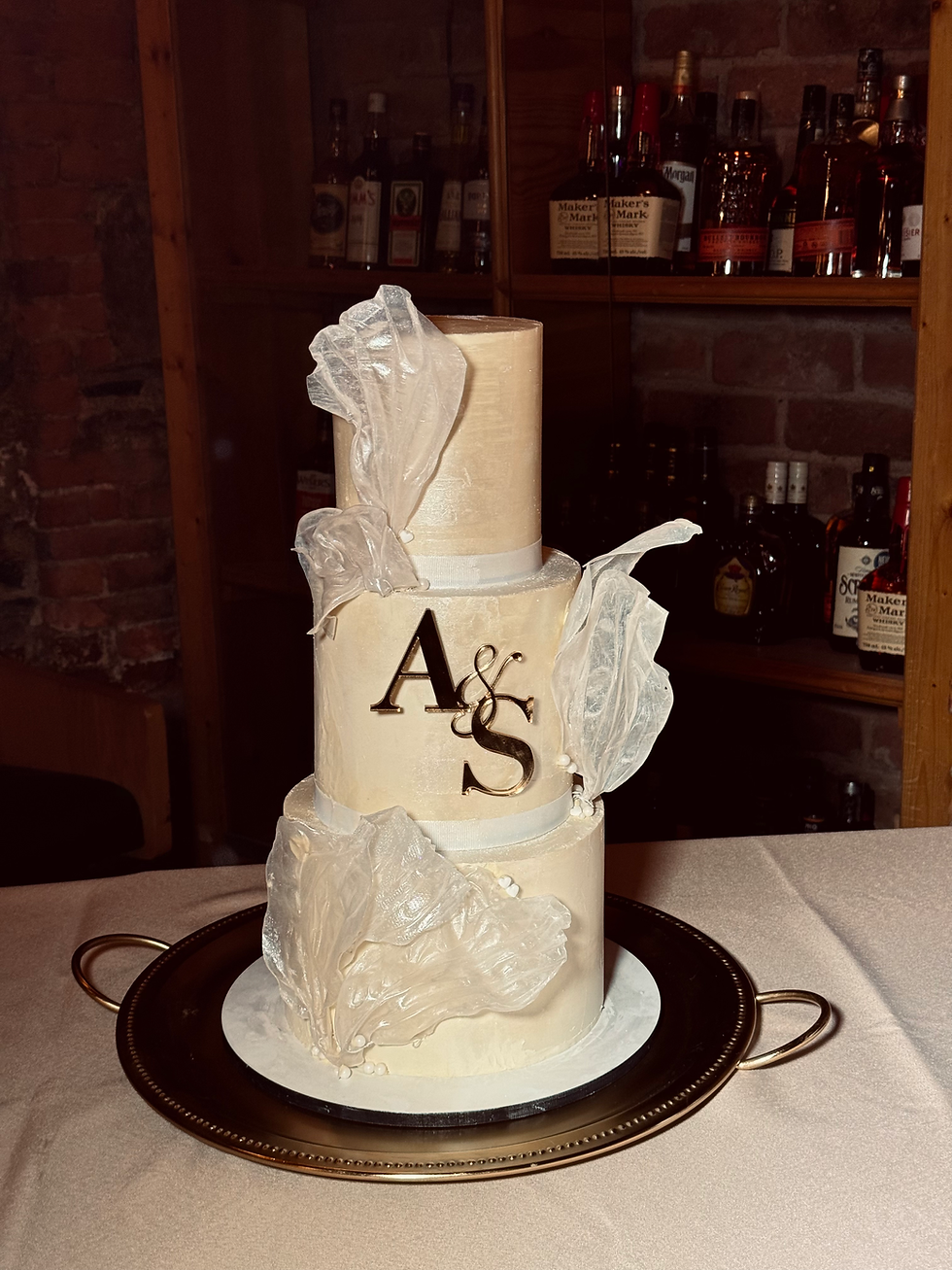 3 tier chocolate covered wedding cake with name letters