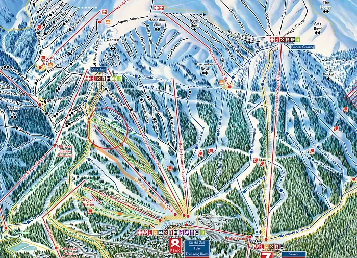 Ski resort trail map showing various runs and lifts on a snowy mountain. Trails are color-coded with names and symbols. Forested areas visible.