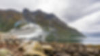 Viking Ocean Cruises' Viking Star in Norway, white ship in small harbor, mountain in background, rocks in foreground