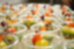 rows of clear cups with produce portions

