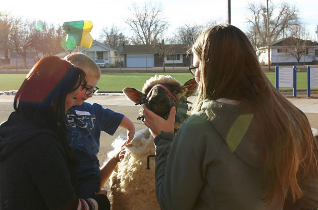 FFA members teach young students about agriculture so they can grow up to be informed consumers