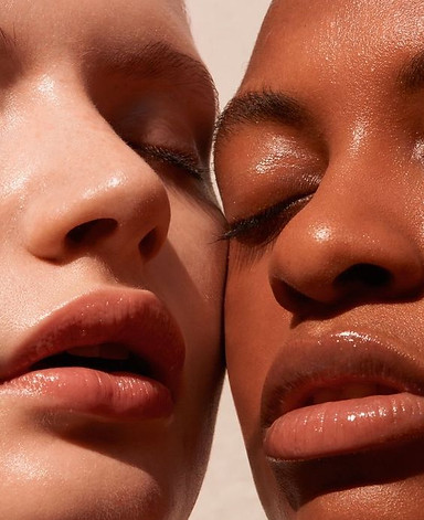 Close-up of two people's mouths and noses close together, showcasing smooth, glowing skin