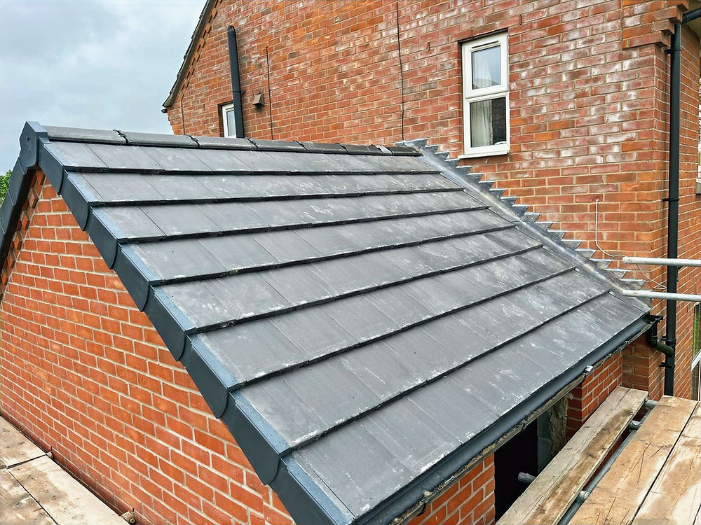 Tiled re-roof on a rear extension with dry verge and dry ridge system installed by Boston Roofing Ltd in Boston, Lincolnshire.