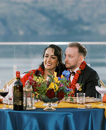 Reception floral centrepieces for an Okanagan wedding with a lake and vineyard views