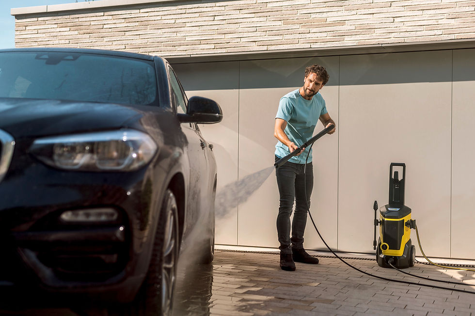 Thumbnail: Man washing a black car with a pressure washer, Kärcher CR 5.220 Automatic Hose Reel, outside