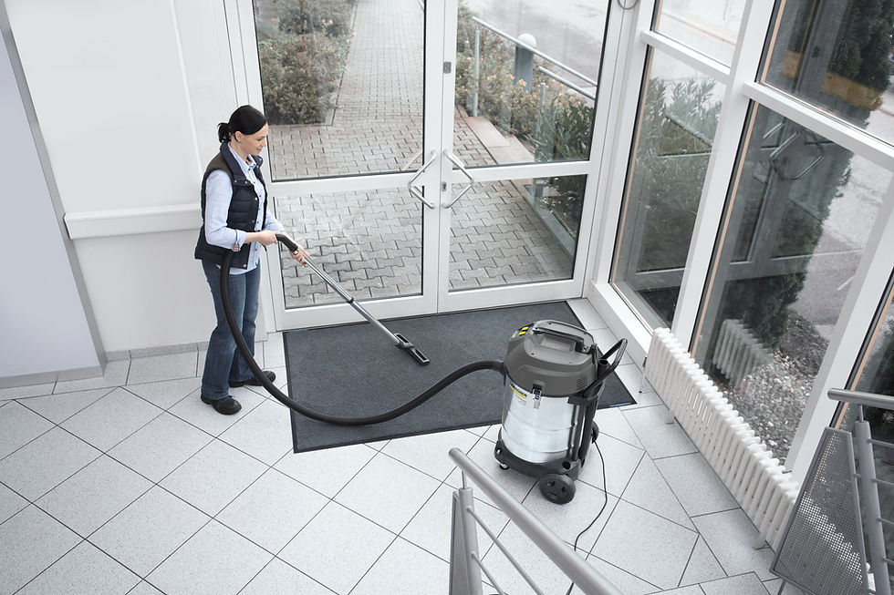 Thumbnail: Woman using vacuum cleaner to clean entrance mat, Kärcher SP 16.000 Dual. FocusShop