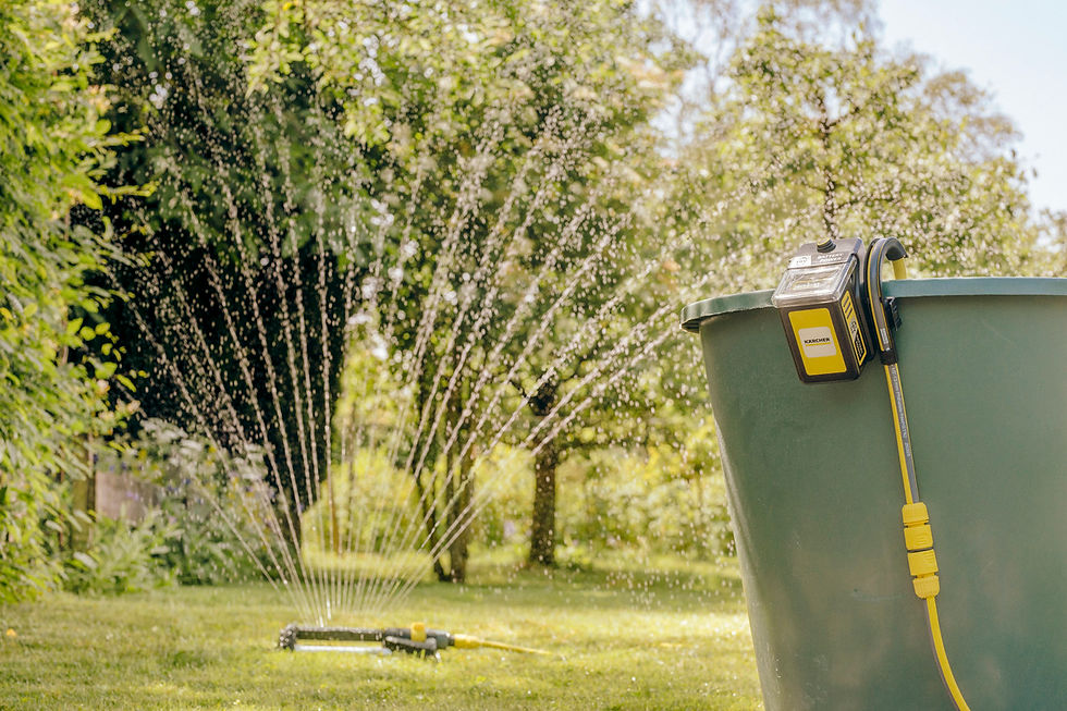 Thumbnail: Lawn sprinkler in action, spraying water on green grass, trees in background.