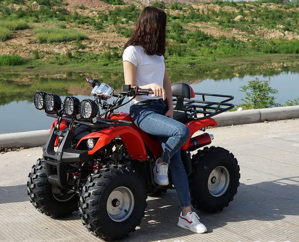 A girl sitting on a powerful atv