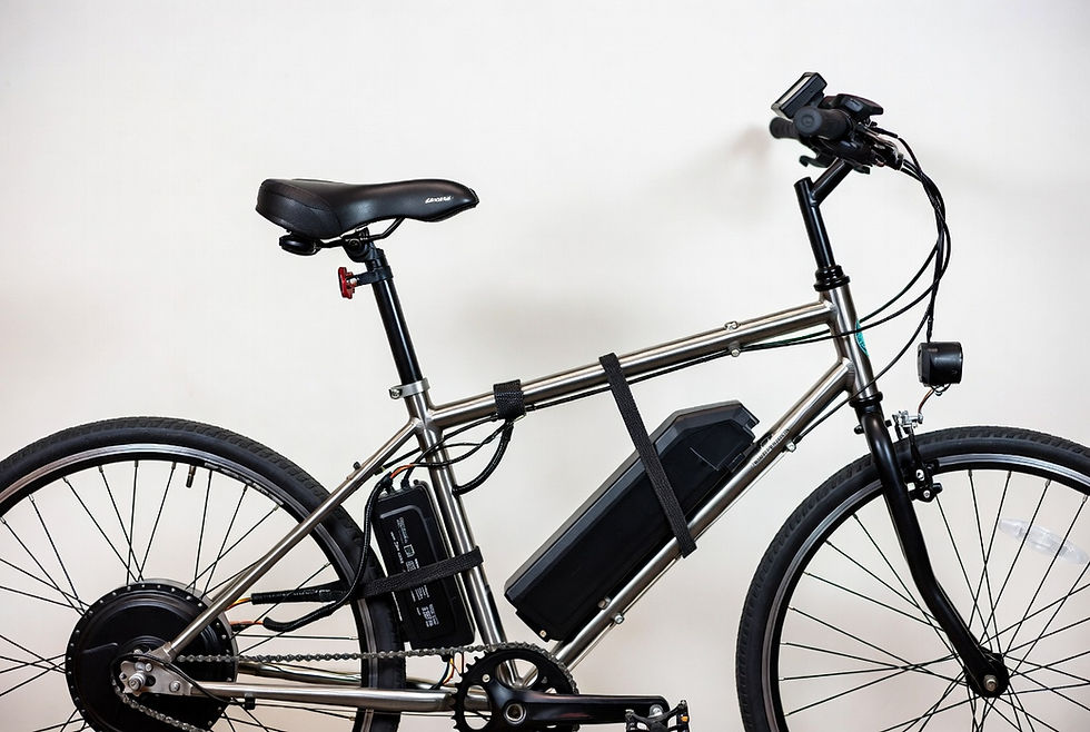 Close-up view of a bicycle frame with an electric motor kit installed