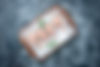 top-view-raw-fish-slices-with-ice-wood-board-grey-background-copy-place.jpg