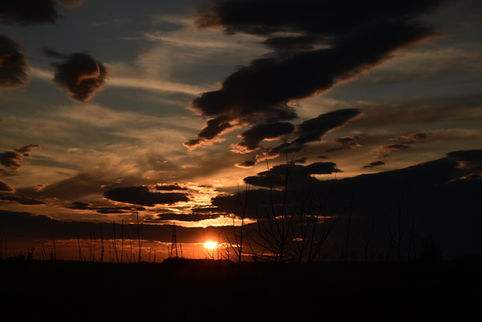 Sunset photos are often boring but this one is (partially) redeemed by clouds which lend it some drama
