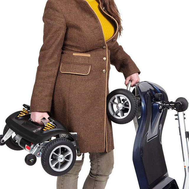lady lifting lightweight take apart mobility scooter pieces
