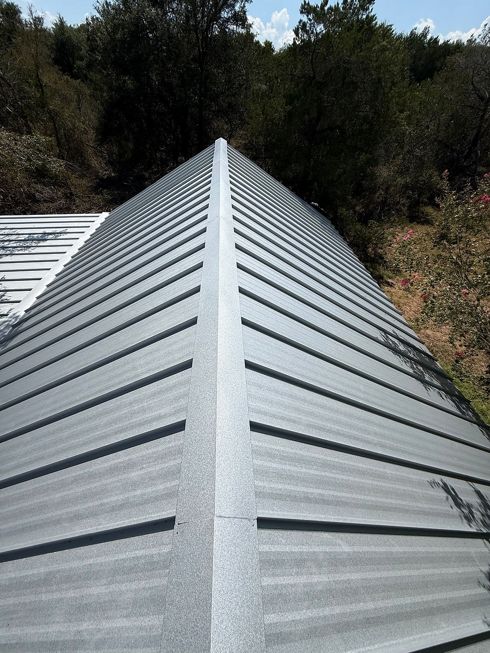 A new metal roof on a house done by SkyDeck Roofing & Construction.