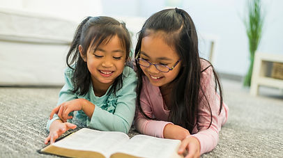 Sisters reading together