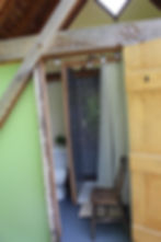Hand-crafted loo and shower building.
