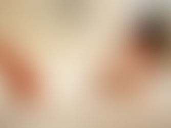 woman sitting in a bath eating noodles