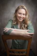 professional portrait photography capturing natural confidence  classic studio portrait with subtle shadow and soft skin tones