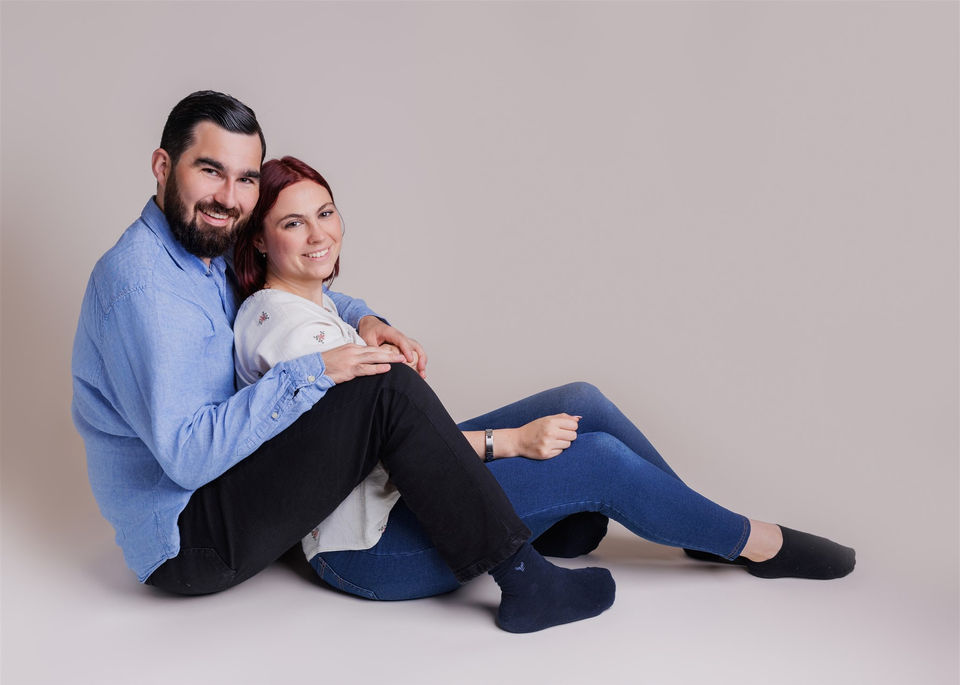 Relaxed family photoshoot in Portishead studio with parents sitting comfortably together