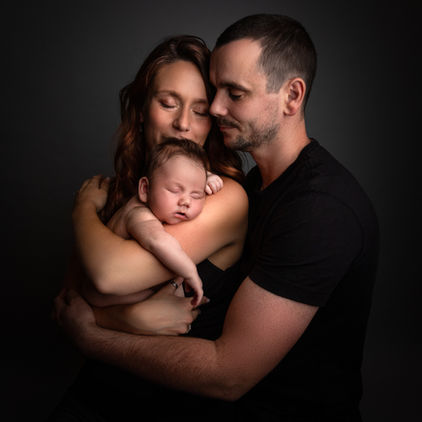 Natural newborn photography capturing connection between parent and baby