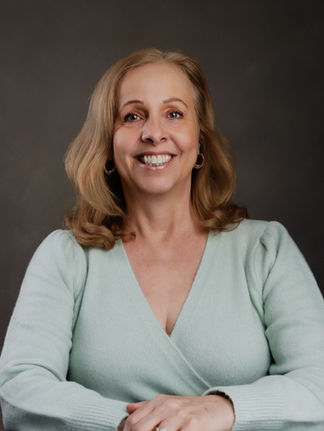professional female business headshot with relaxed confident expression