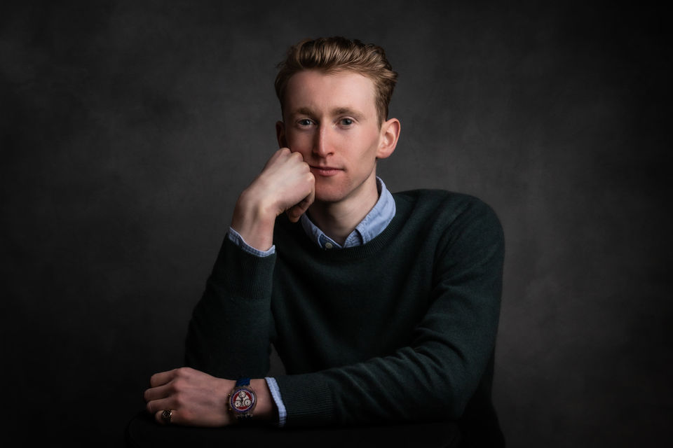 Studio portrait of a man photographed in a professional portrait studio in Portishead, near Bristol, with calm, natural expression.