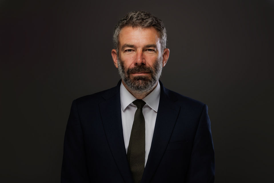 Modern corporate headshot of a male professional in bristol studio