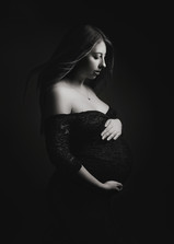 Fine art maternity portrait in Bristol with dramatic low key lighting