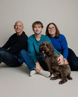 Natural family portrait in Bristol featuring parents, older children and family dog