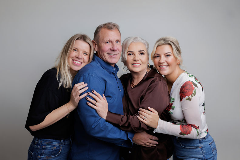 Extended family portrait in a Bristol studio with multiple generations together