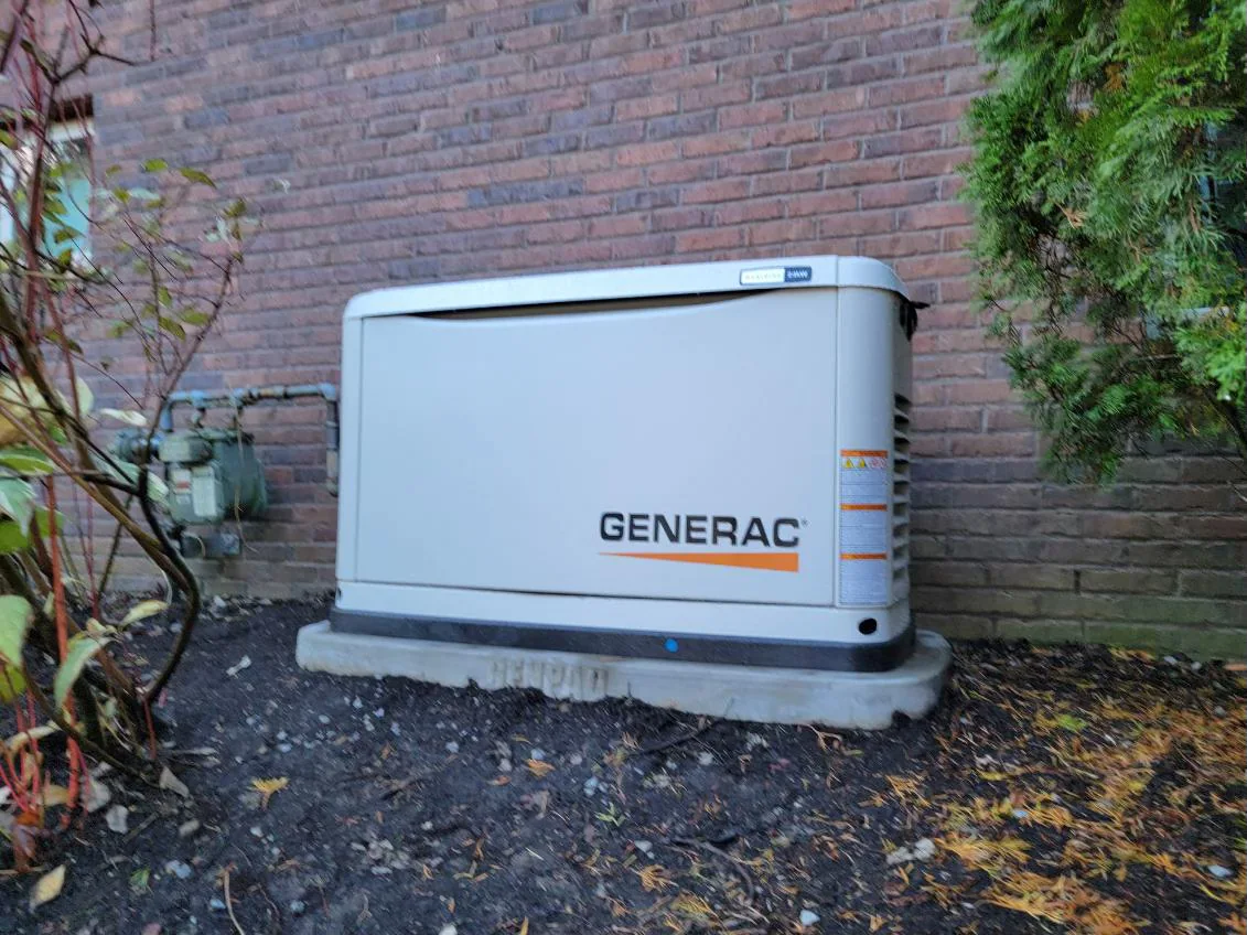 Generac standby generator installed beside a home, a Lytle Electric project