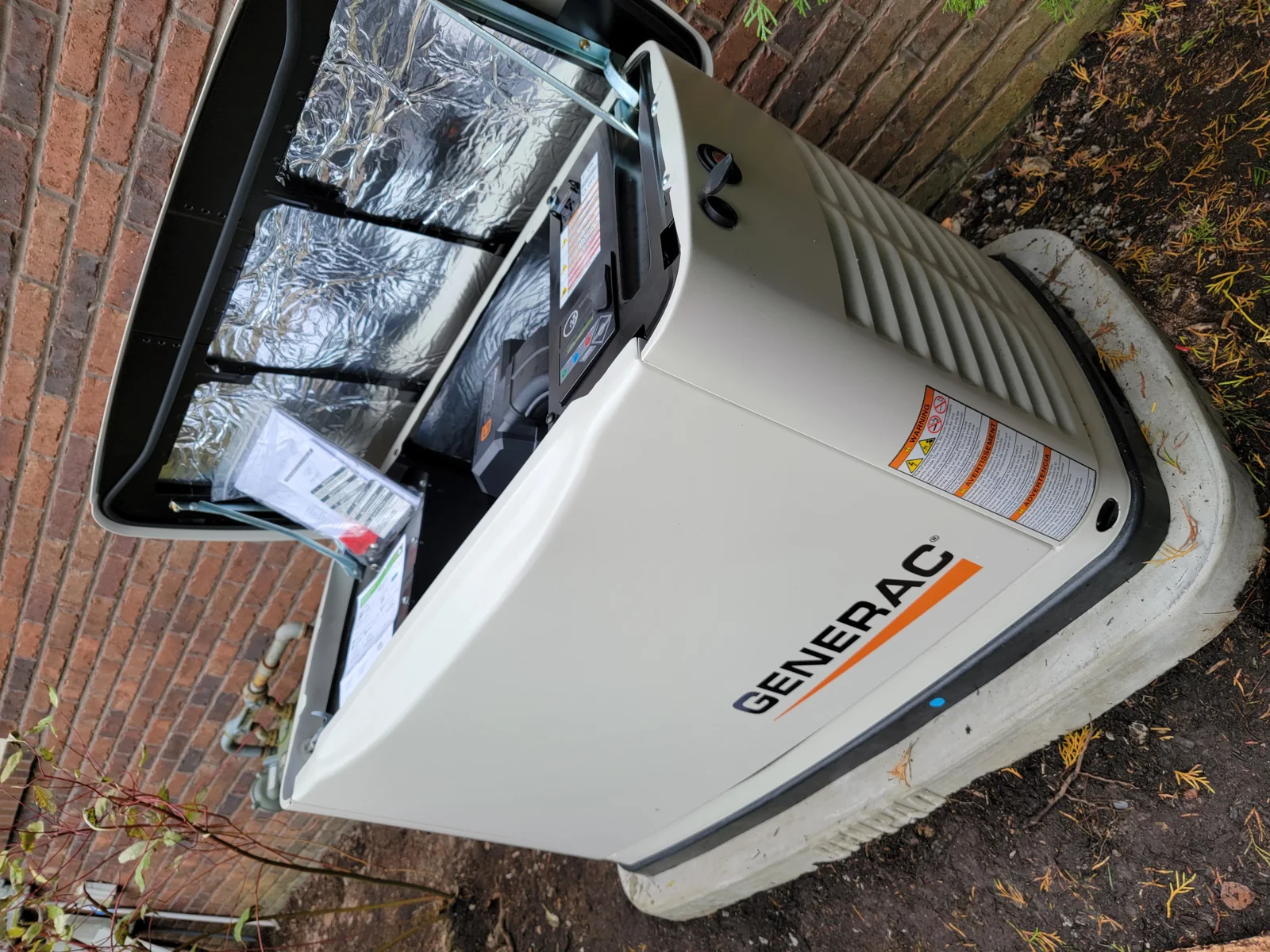 Generator installation detail. The generator with its enclosure open during project work.