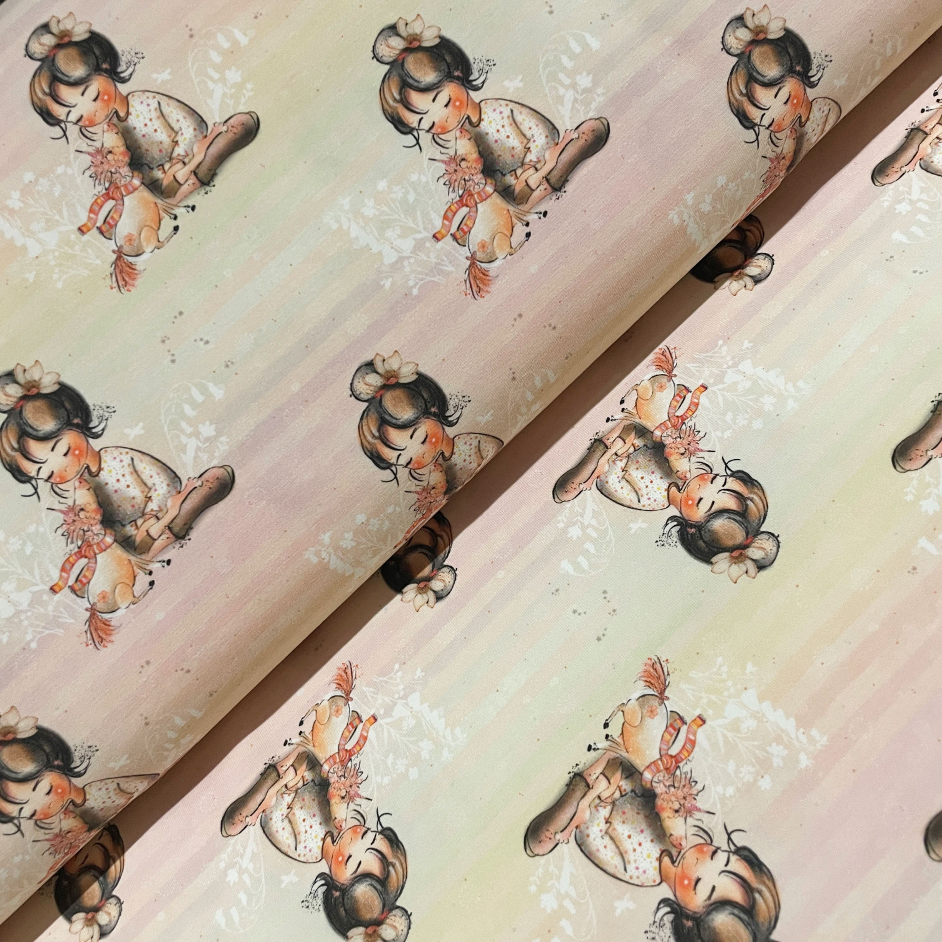 Jersey mit Mädchen und ihrem Einhorn, auf dem Stoffballen