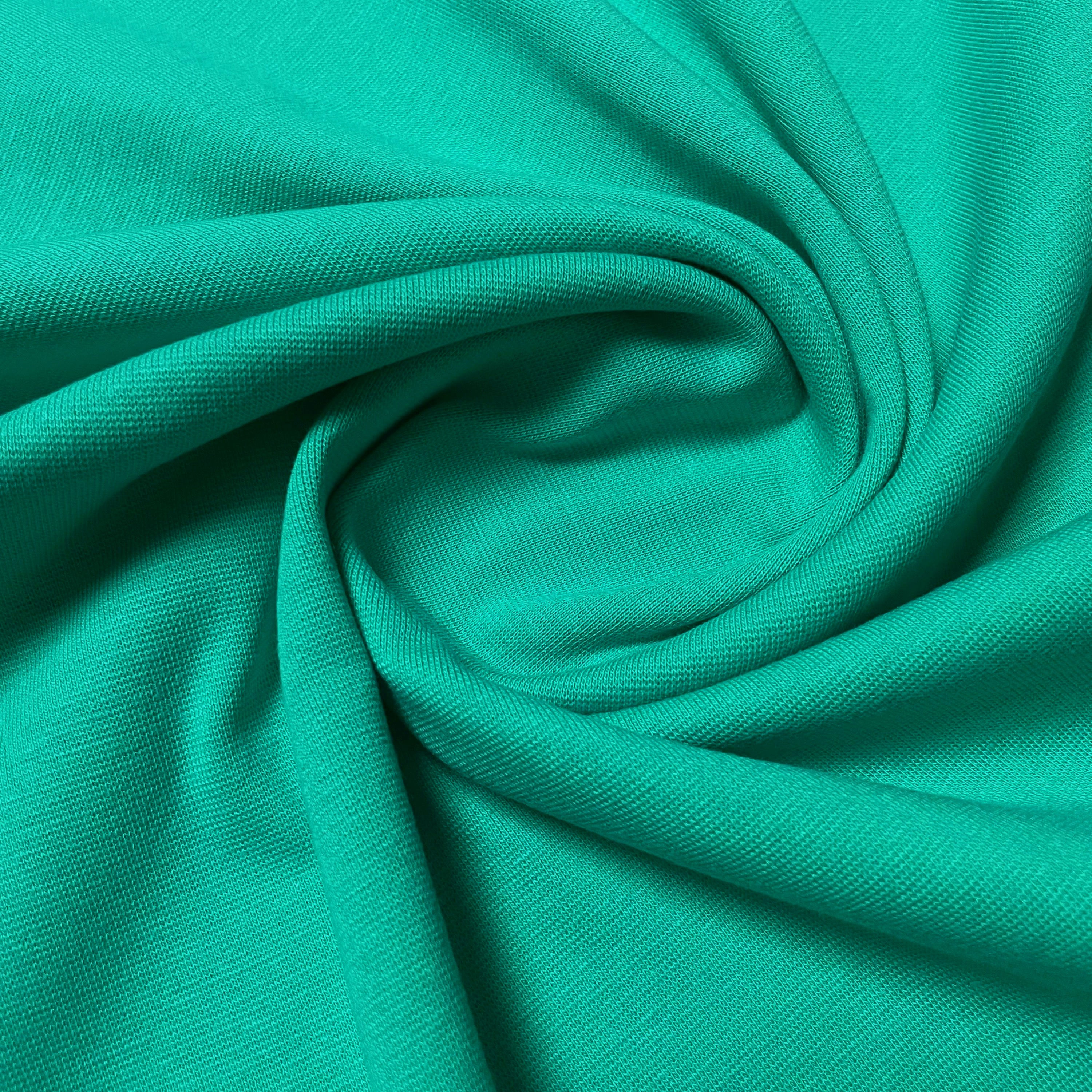 Bündchen in kräftigem Türkisgrün